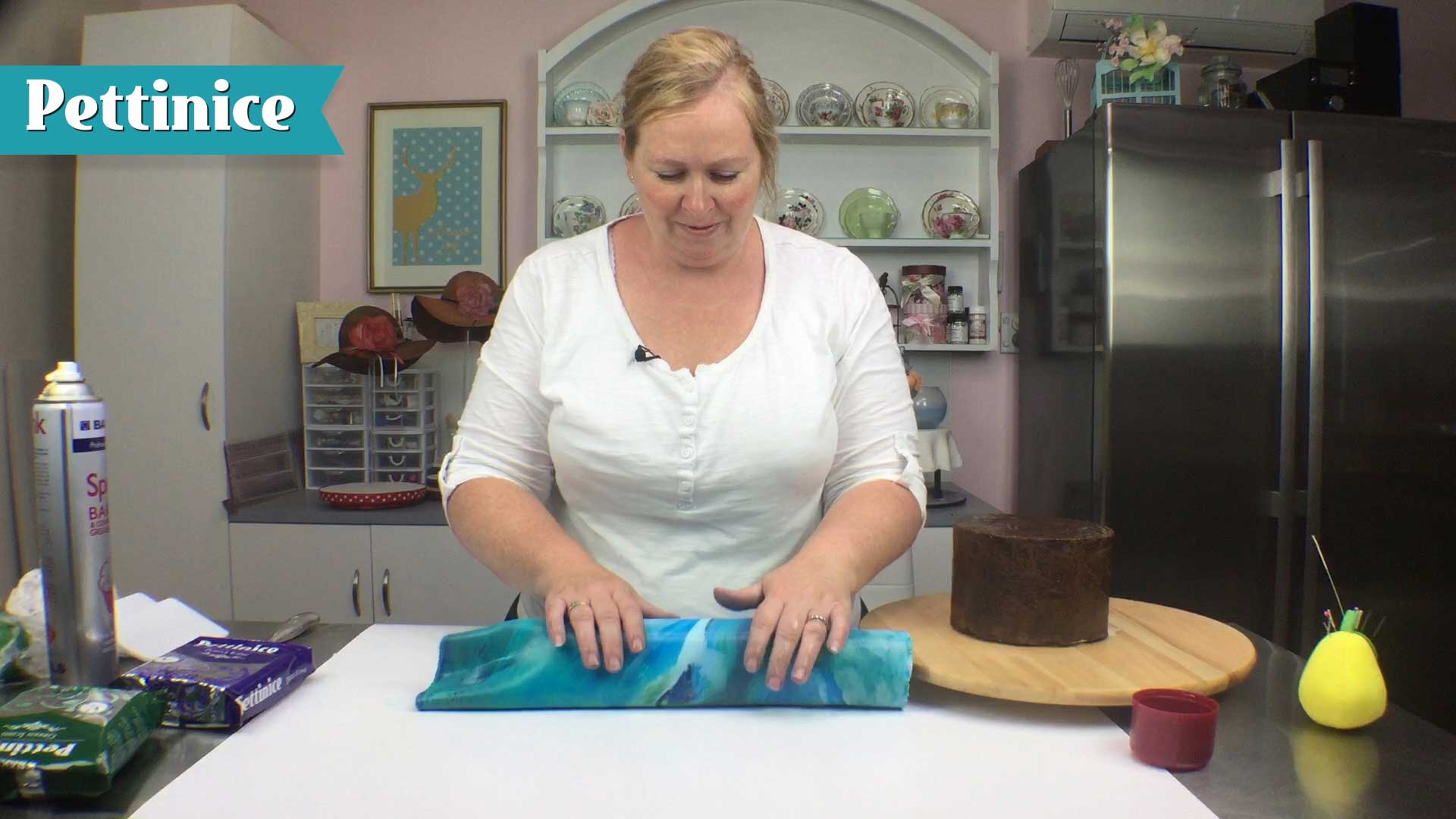 Use your rolling pin to secure your fondant.  Sprink will ensure it doesn't stick together.
