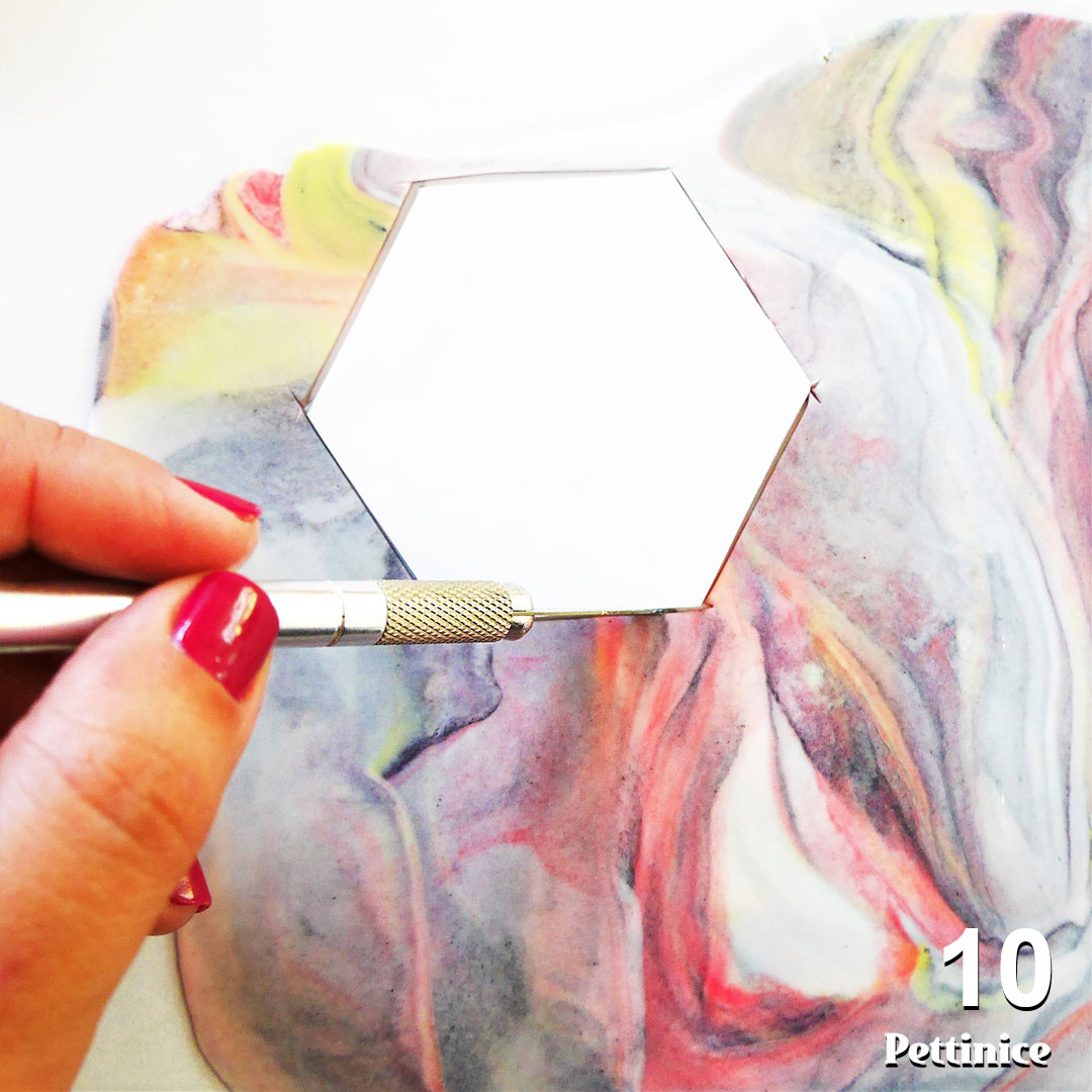 Step 10: Use your template and craft knife, or desired cutter to create your accent pieces.  Please note:  You cannot roll up the scraps and have a nice marble pattern the second time around, so get as many cuts as possible from this piece of gumpaste.