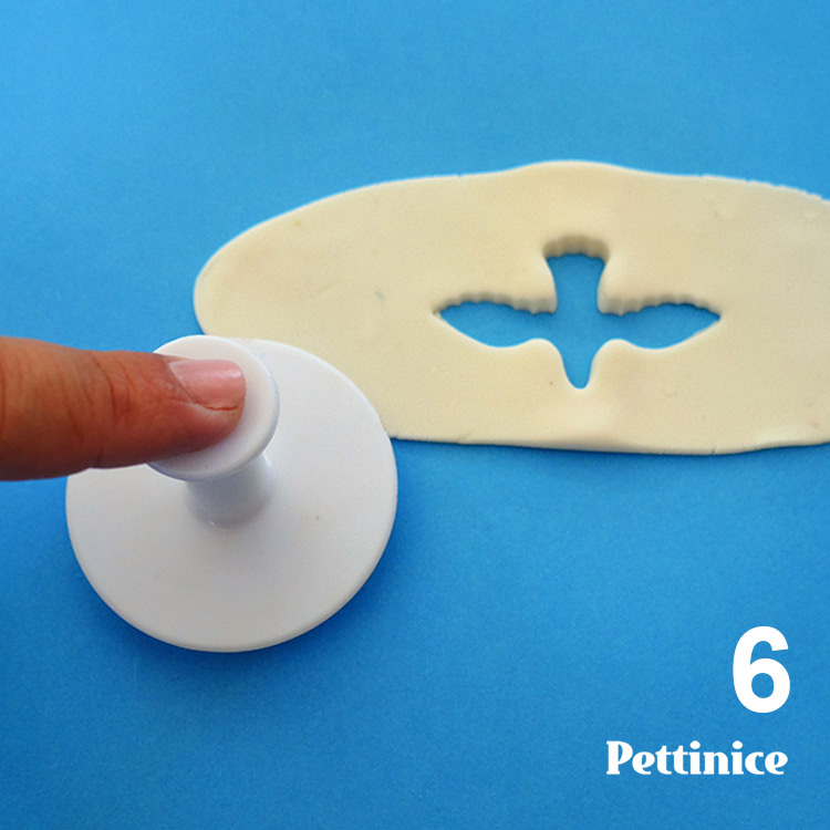 Gently press down on plunger to emboss your fondant.