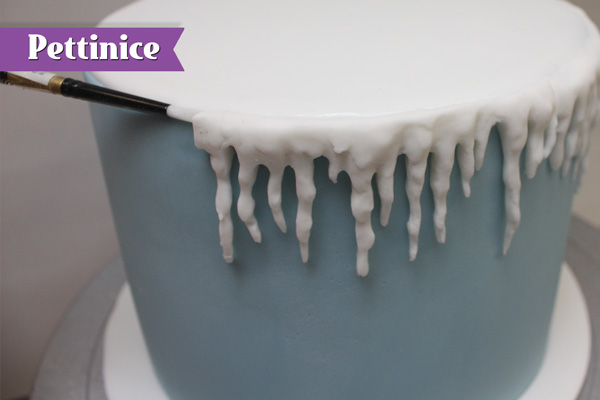 Attach the molded icicles to the top edge of the cake so it joins the white circle.