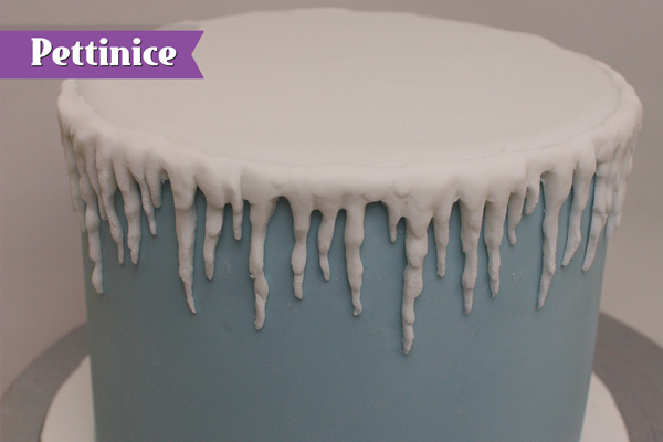 Keep attaching icicles around entire cake.