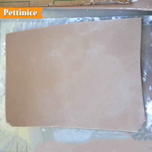 Roll out a thick rectangle of fondant which will be your bottom book cover, and put it on some baking paper .