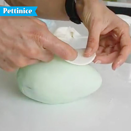 Roll out a small egg shaped piece of white Pettinice and place
