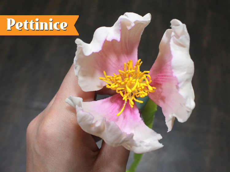 12. For this flower, continue adding additional two petals as shown.  Your first layer will have 3 petals .
