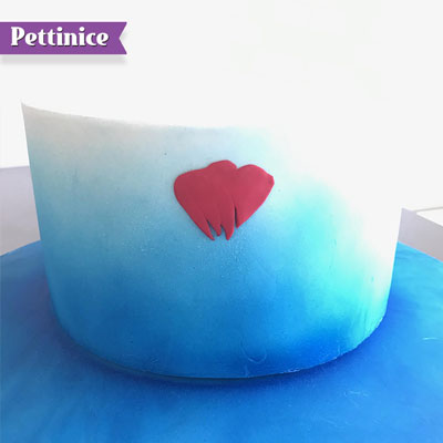 Spray your cake with Bakels Sprink rather than water ensures that you can change the position of your petal for a longer period of time afterwards if need be. Once sprayed,  start placing your petals on in a circular motion.