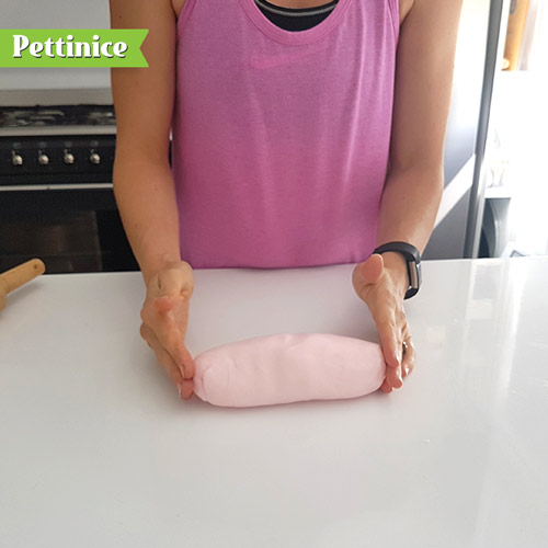 Knead your pink fondant until nice and soft. Roll in to a large sausage shape.