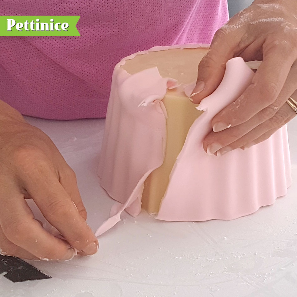Overlap your join and cut a line through both layers of fondant. Remove excess and seal together.