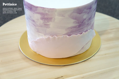 Using water, attach ruffle side up on the side of your cake.