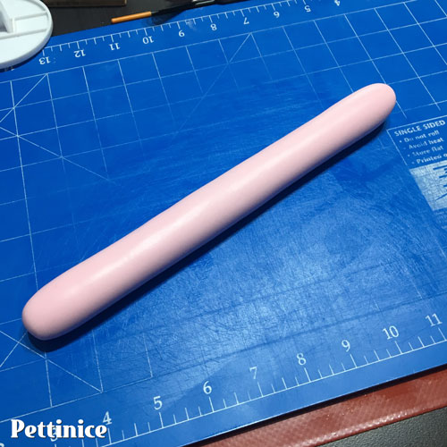 Roll the fondant into a long sausage shape and then use your rolling pin to roll out a thin strip long enough to go around your cake.