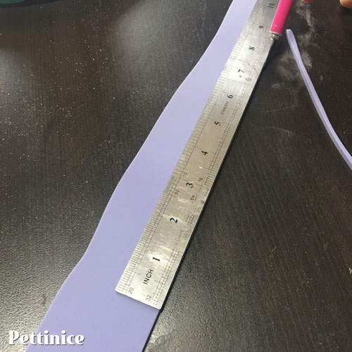 Using a ruler, cut the bottom edge straight  and to the measurements you worked out earlier.