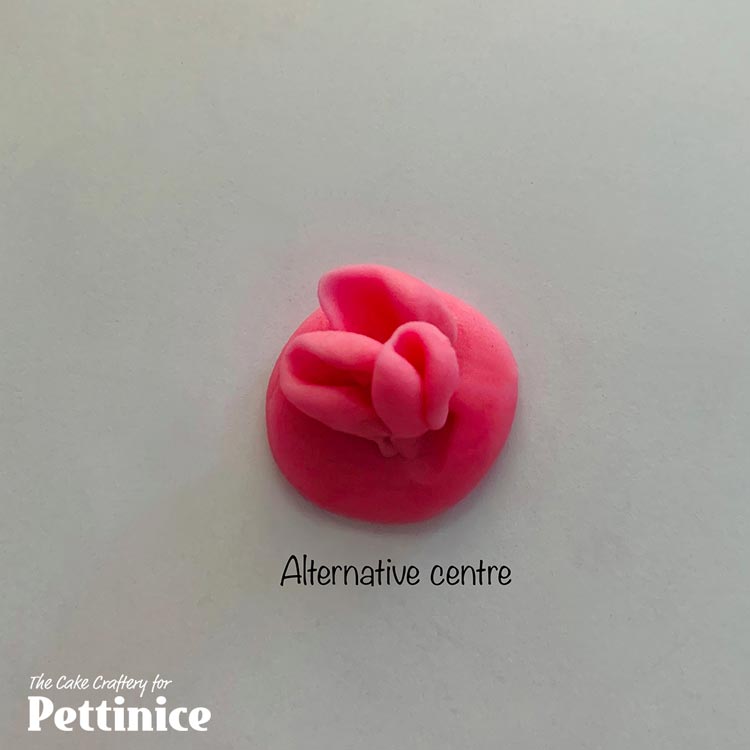 This is an alternative centre that I have used on 2 of my roses for variety. Press the centres of 3 x 4mm balls of darker pink fondant with your Dresden tool and arrange like so.