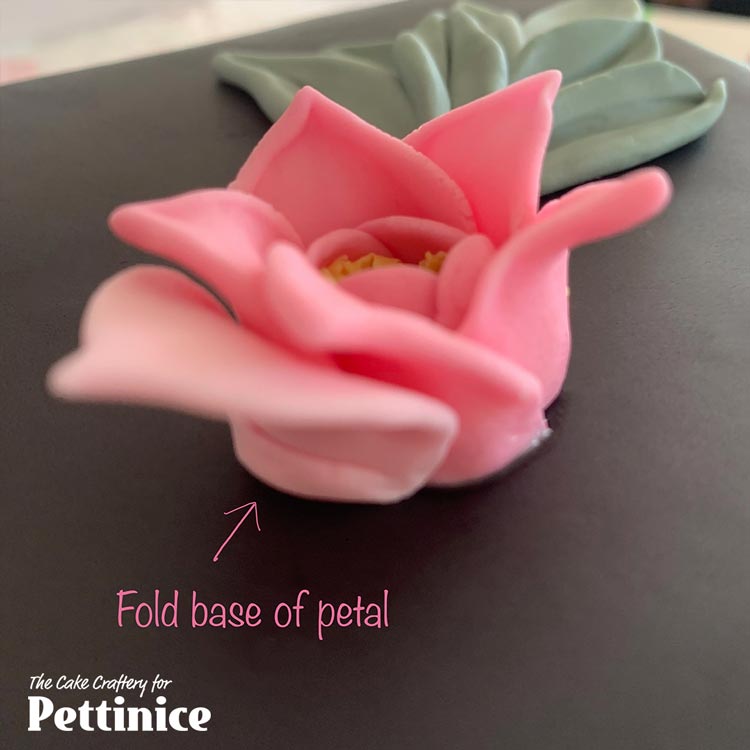 Repeat the process with 6 larger balls (around 1.8cm) of your lightest pink. Fold the base of each petal out to give it stability, glue.