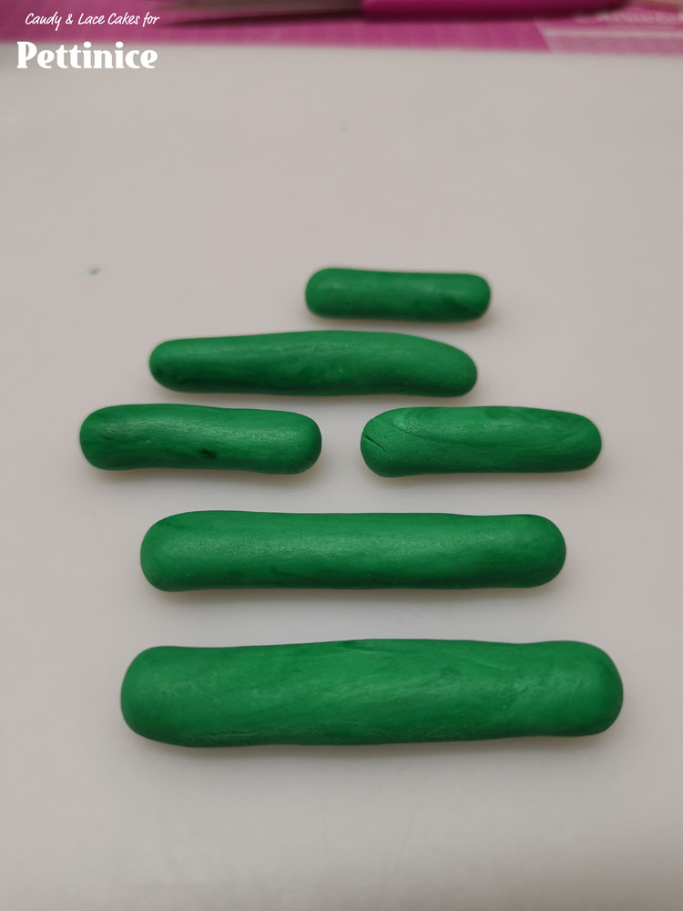 Roll each ball into a long sausage shape.
