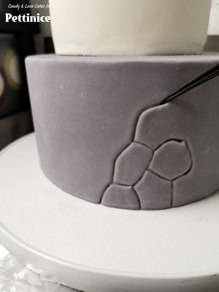 Use your dresden tool to create lines and creases all around the bottom tier.