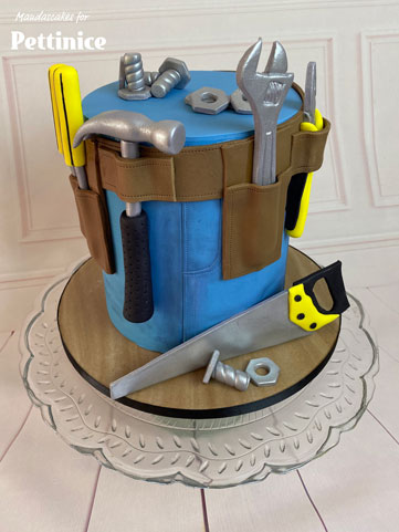 Place the saw at the base of the cake, and randomly scatter the nuts and bolts where you want them.