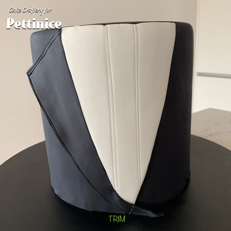 Attach the right lapel to the cake, butting it neatly against the shirt front. Don’t glue the outer edge of the lapel to the cake - let it sit out from the cake to look more natural. Trim the excess at the point as shown.