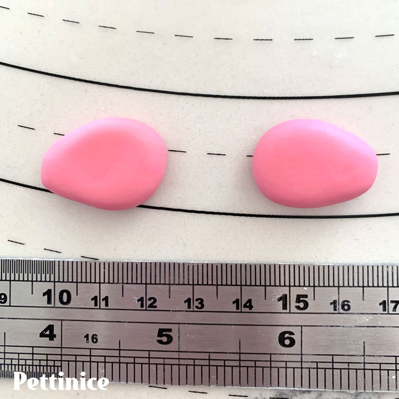 17. Using some of the darker pink Pettinice, make marble sized balls and flatten into teardrop shapes for mittens.