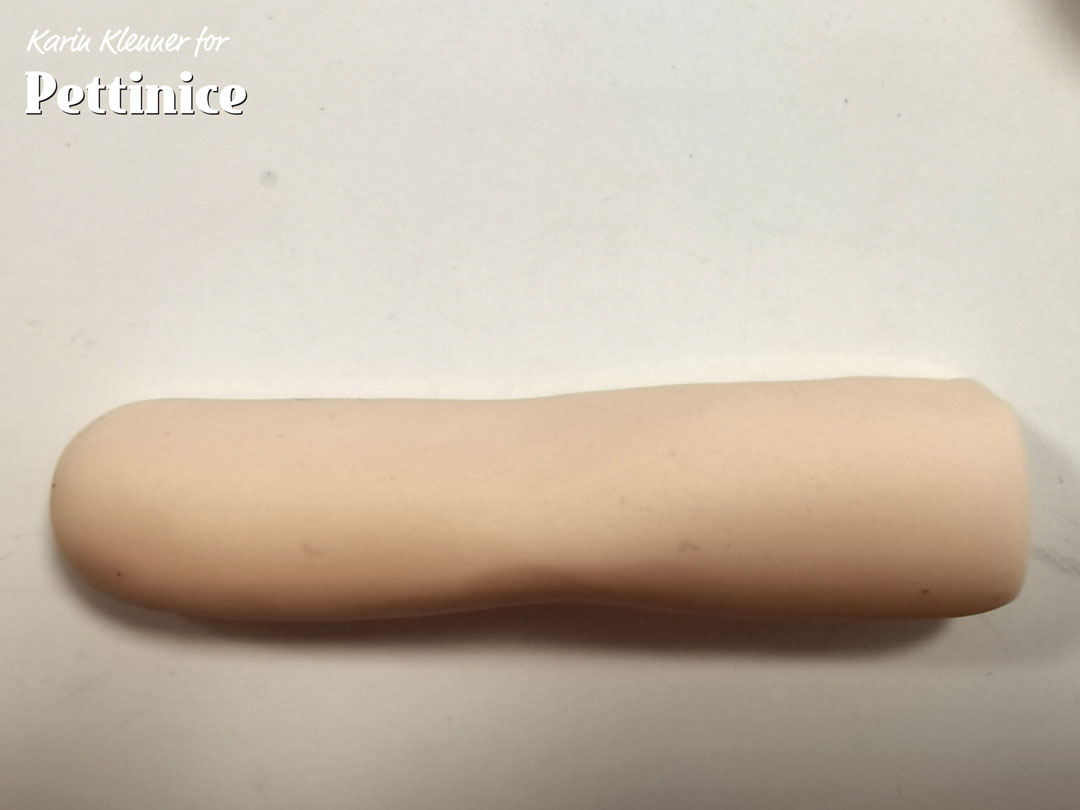 Roll out into a sausage shape as shown, and cut one of the ends flat.