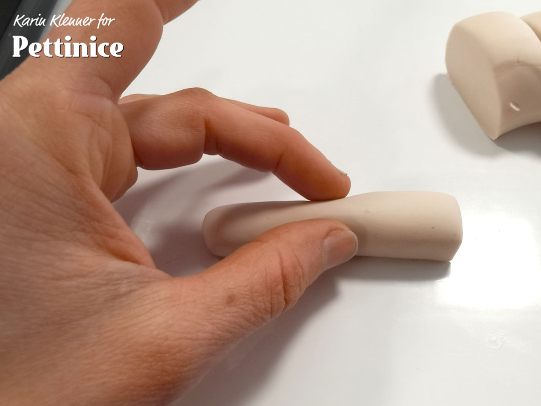 Squeeze the middle a bit to create a knuckle