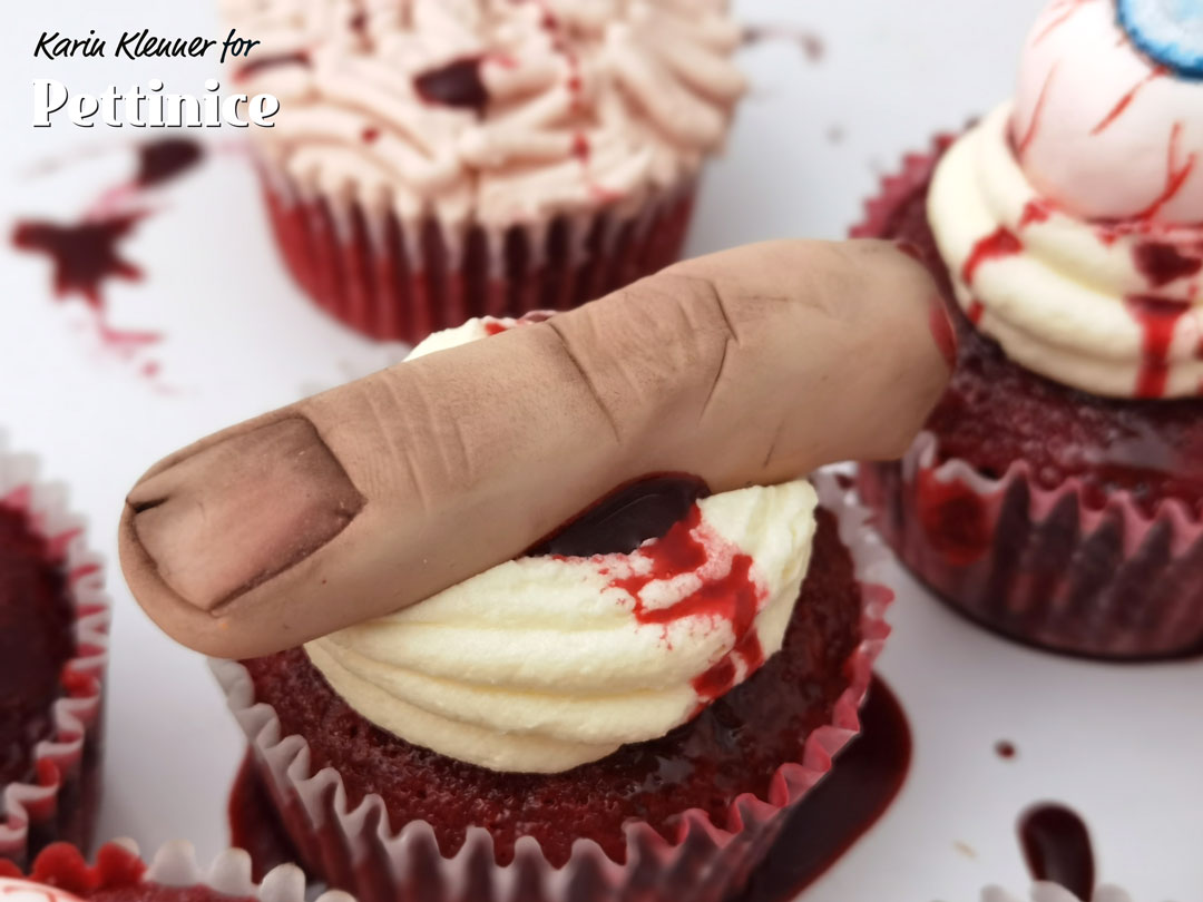 I placed my finger on top of a red velvet cupcake with scatters of fake edible blood to really make them creepy!
